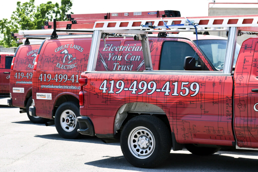 a line of ted trucks with the Great Lakes Electric logo